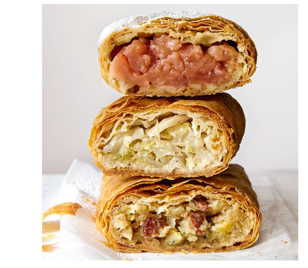 Cabbage and goose fat retes stacked on top of each other, 3 retes stacked on top of each other with cabbage and goose fat inside of them.